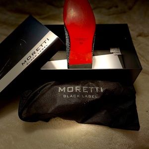 Black Suede upper. Leather lining. Red sole with silver crystals
Size 10.5